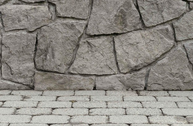 Close-up of textured stamped concrete wall and stone-patterned surface showing realistic design detail in Brecksville, OH.