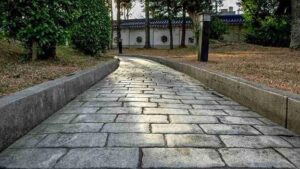 Beautiful stamped concrete walkway leading through a landscaped garden in Brecksville, OH.