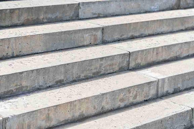 Close-up view of clean, newly built concrete stairs with smooth finish and uniform edges.
